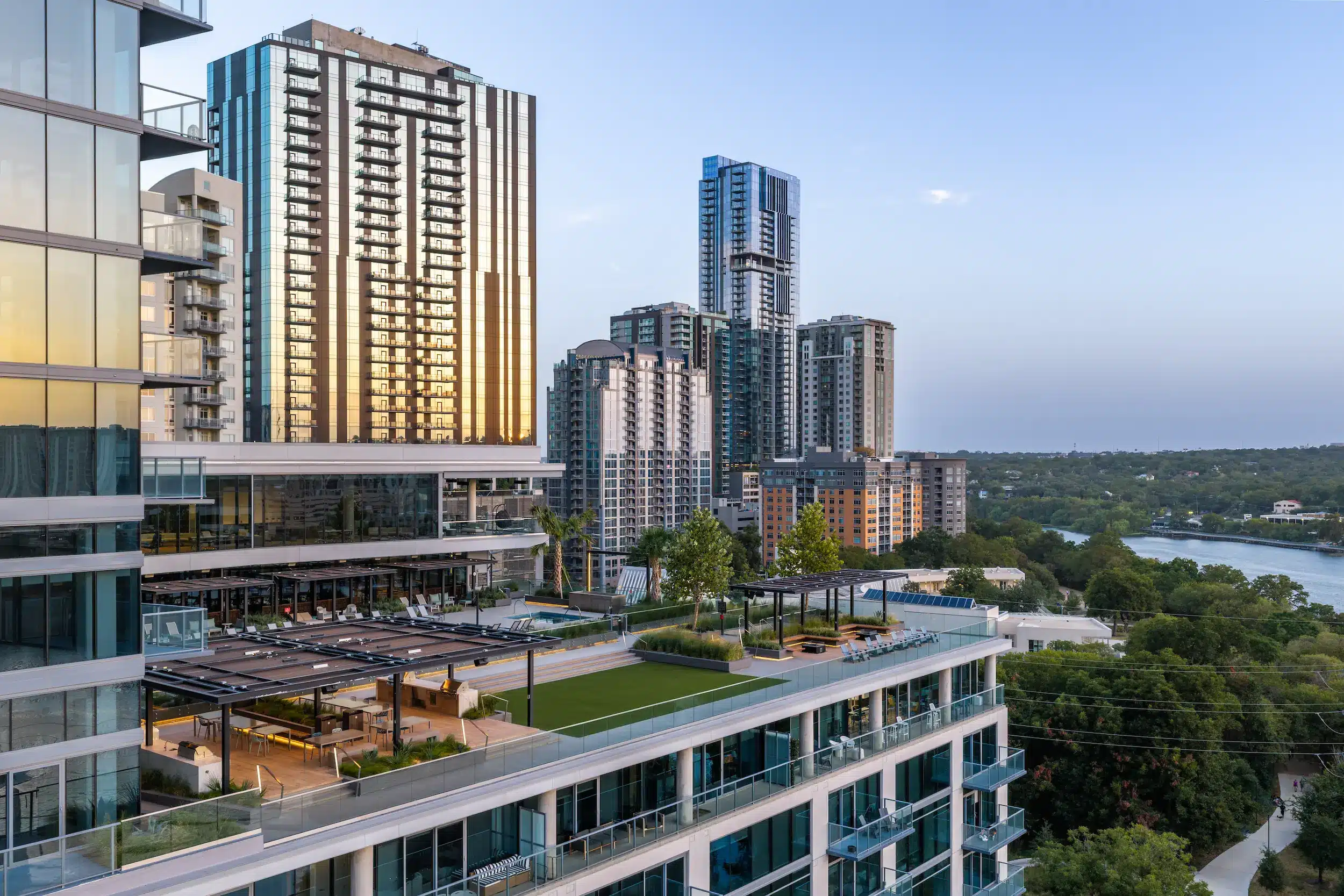 The Travis ATX amenity terrace and surrounding Austin towers